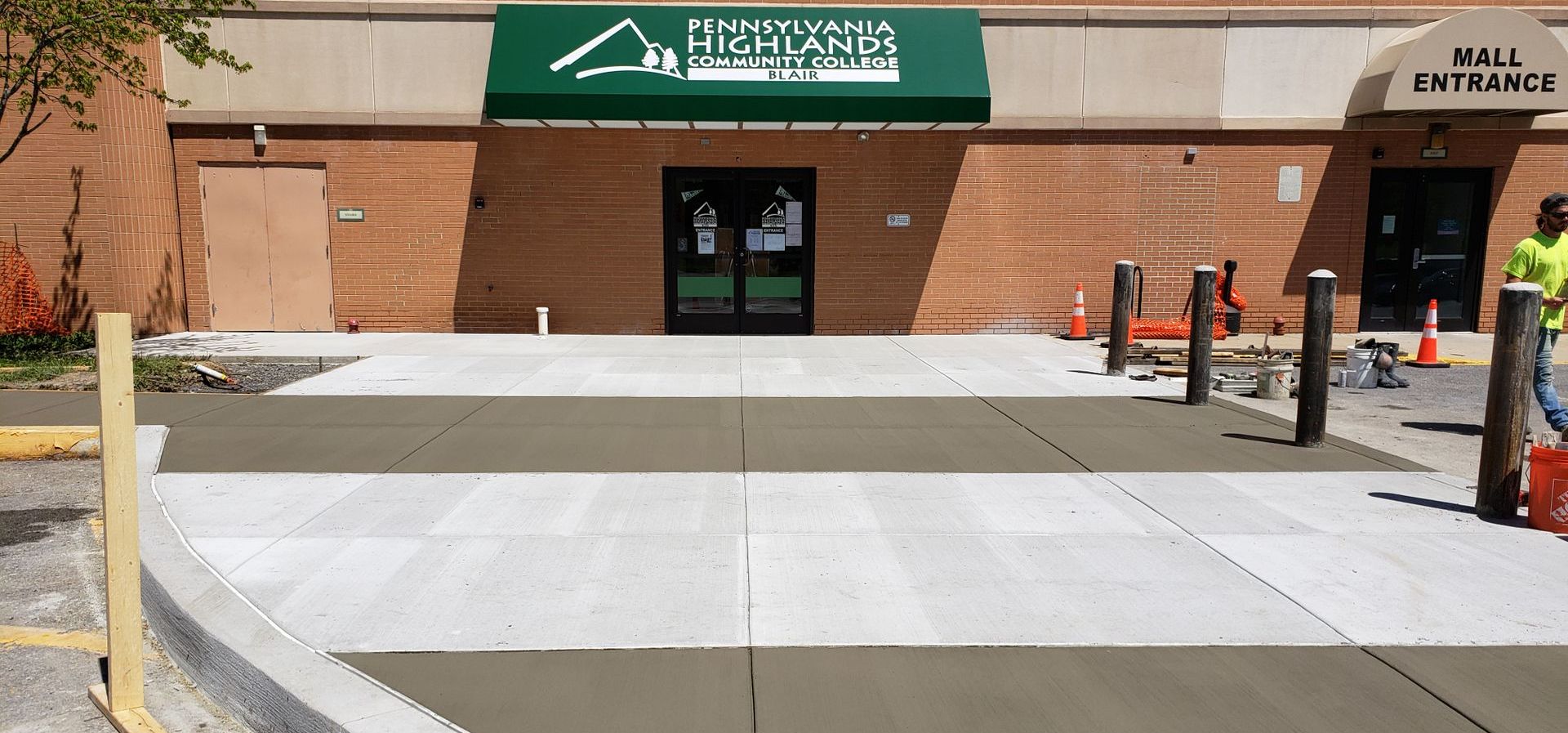 Concrete pad and apron at a commercial entrance