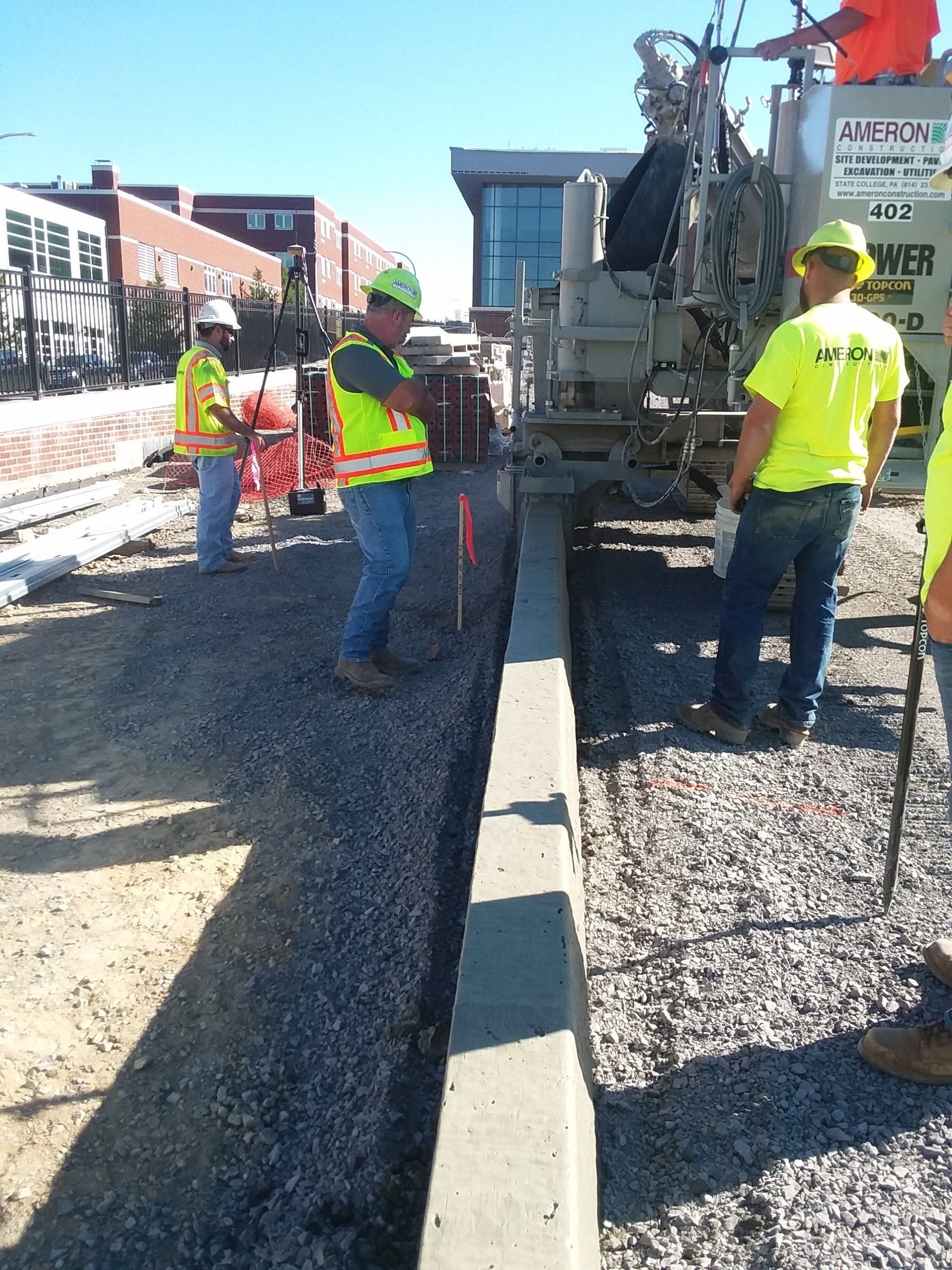 Ameron crew placing concrete curb