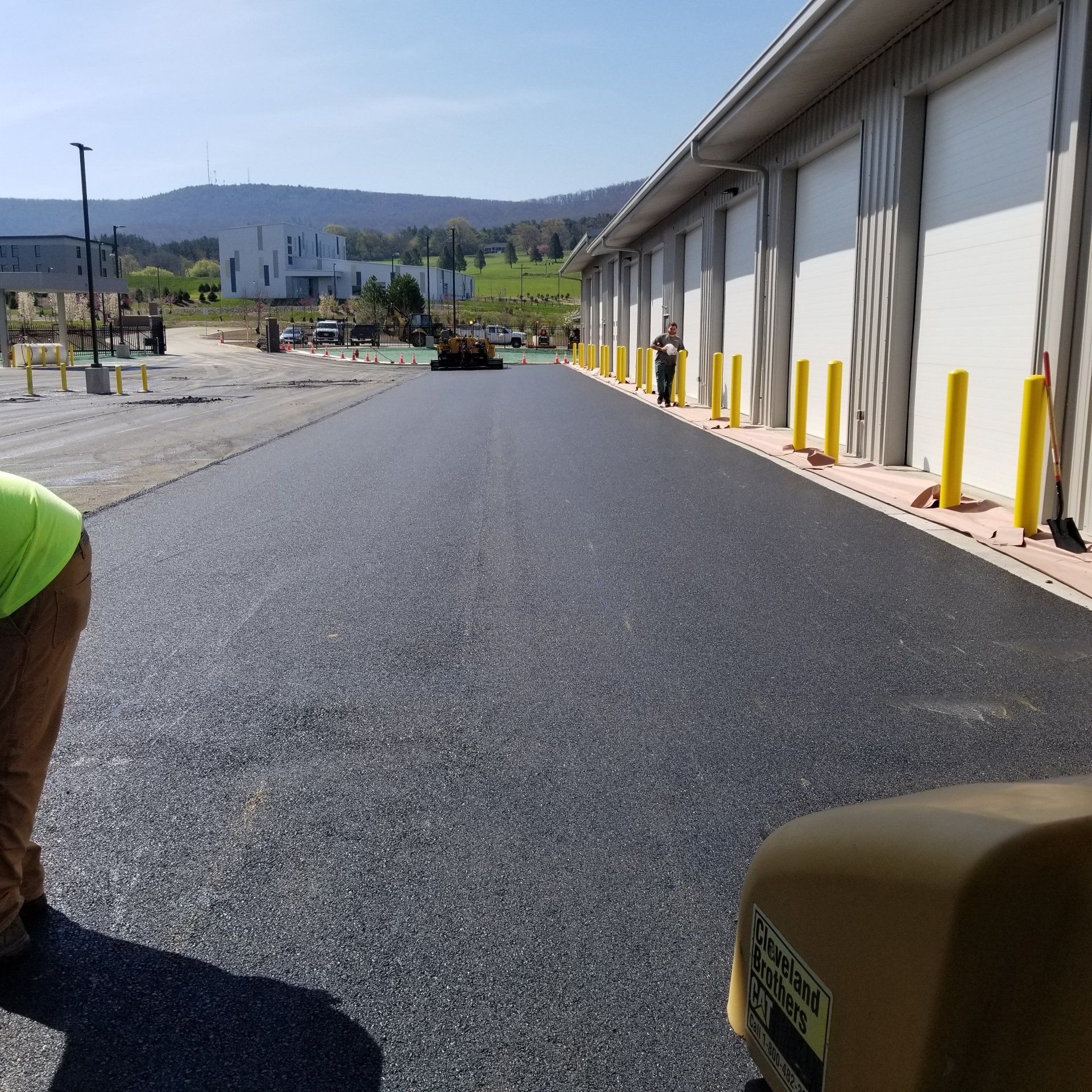 Fresh asphalt paving at a commercial building